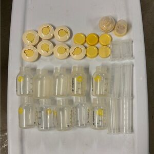 Various Medela Bottles, Colostrum Collection and Storage Containers with Lids